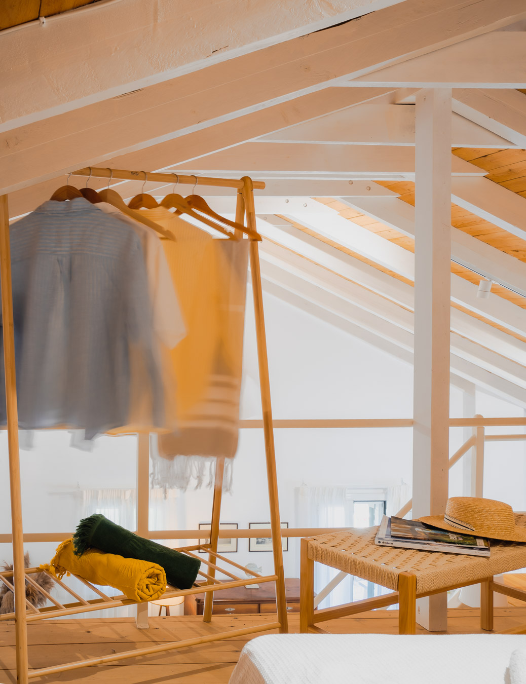 Loft corner with clothes rack and reading bench