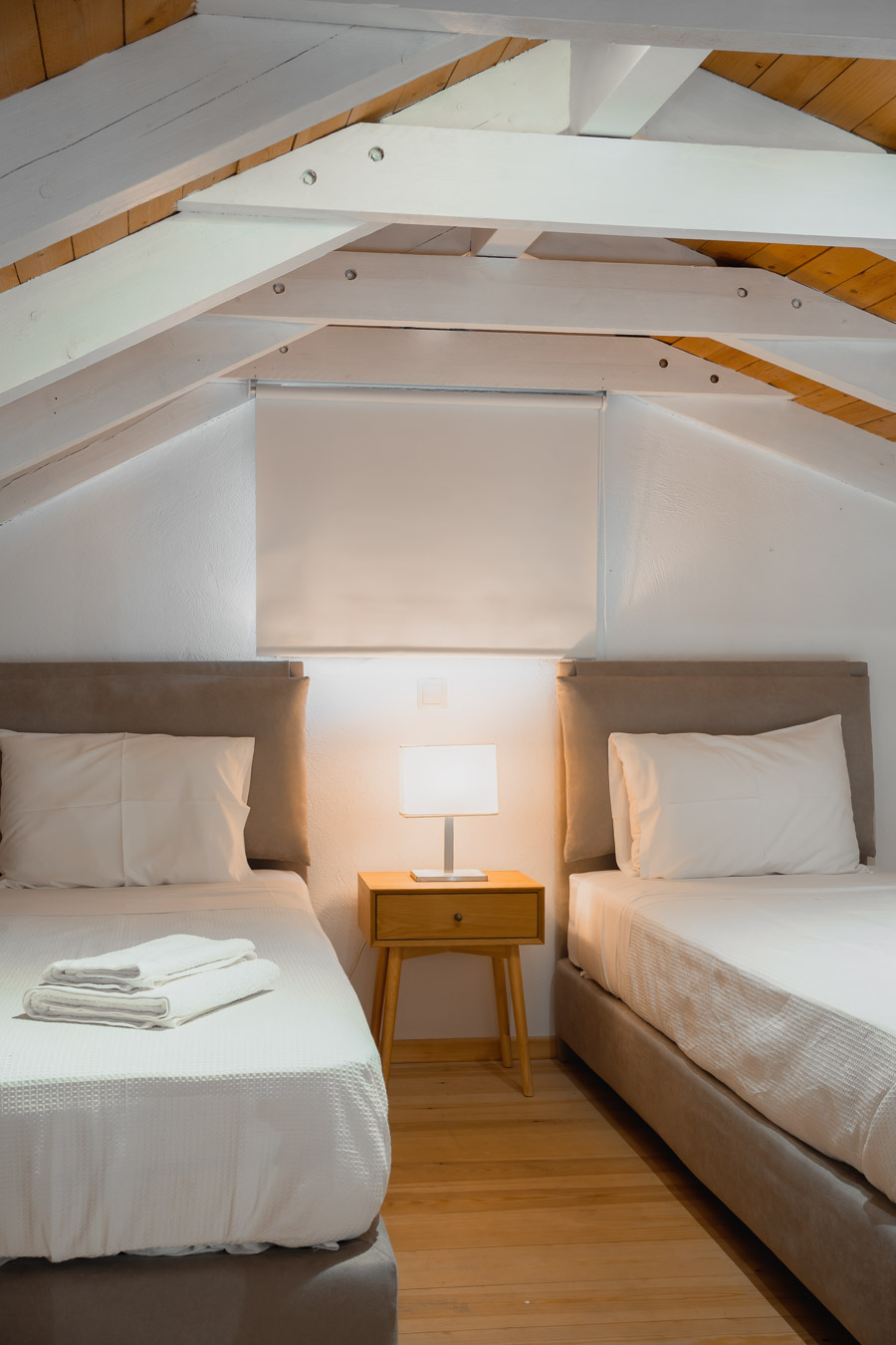Loft bedroom under wooden beams